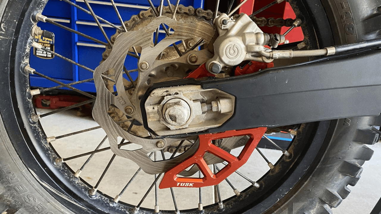 Tusk Rear Brake Caliper Support w/ Brake Disc Guard Review